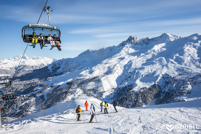 Chair lift & skiers in Meribel valley