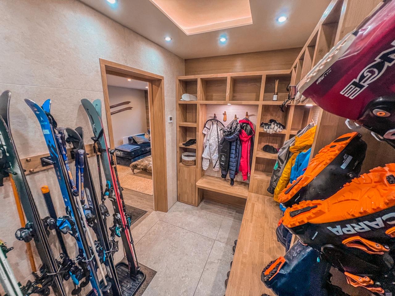 QM ski room with entrance to TV room